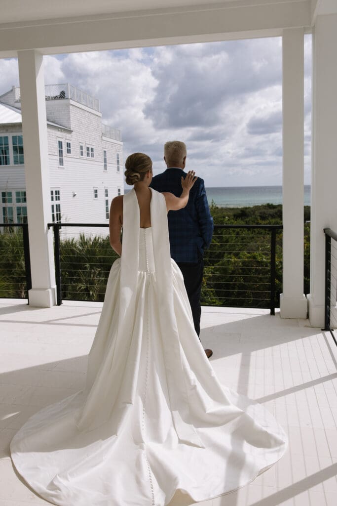 First look with dad at a backyard beach wedding in Rosemary Beach, Florida